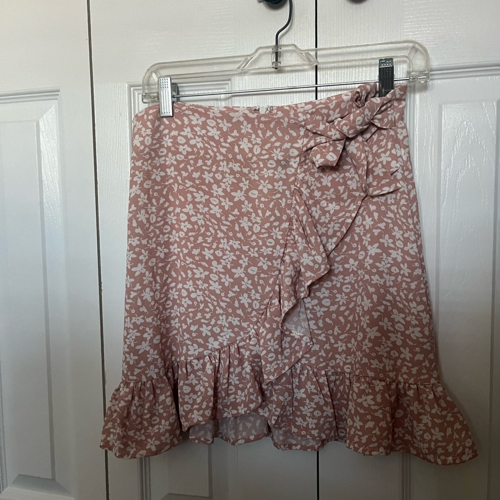 Pink floral mini skirt with a tie in the front, size small